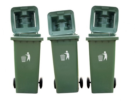 Three green wheeled rubbish bins with open hinged lids, positioned on a paved outdoor surface in a straight row. The bins are made of durable plastic with a slightly textured finish and feature a white pictogram of a person disposing of waste. The bins appear clean and are set against a plain neutral background, suggesting a typical waste collection point in a residential or commercial environment. The open lids reveal the interior of each bin, which is empty and ready for waste disposal, indicating they are prepared for collection. The scene is evenly lit with natural light, highlighting the colour and texture of the bins. This image is relevant to rubbish removal services in Walthamstow, providing a clear visual of waste storage containers used in local waste management practices. Business Waste Removal Walthamstow often supplies such bins for prompt and professional rubbish collection, supporting local waste disposal needs.